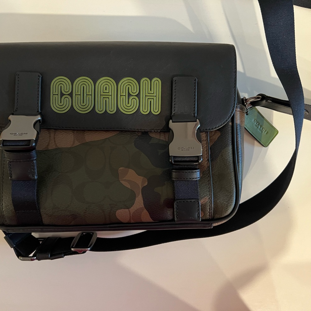 Coach messenger bag, its a mans bag but I tried it for a woman.